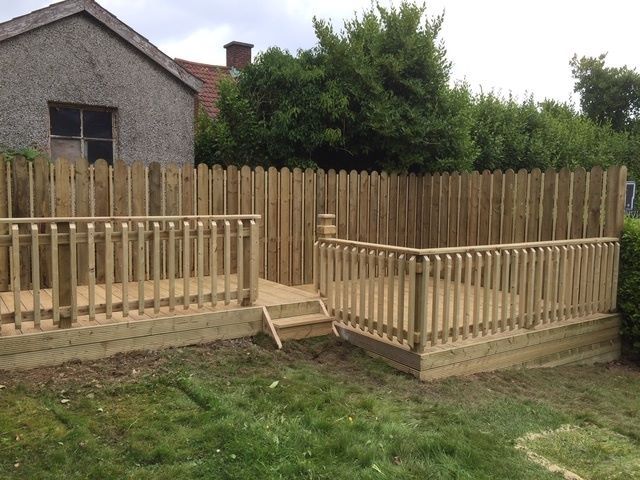 New fence with a smart deck, handrails and stairs to complement it