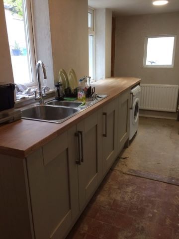 The completed kitchen on the one side of the room