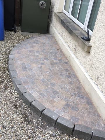 A little bit of paving means a little less gardening and no weeds for another happy customer