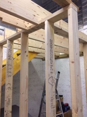 Construction of timber stud walling incorporating staircase and supporting timber mezzanine floor